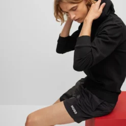 Hugo HOODIE AUS BAUMWOLLE MIT LOGO-LABEL 10665679 -Woehrl Online Shop 50455958 001 340 ZA B2C SHO 04 valid until 2024520