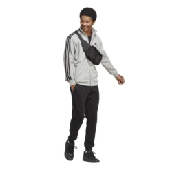 Adidas Sportswear Basic 3-Streifen French Terry Trainingsanzug 10680739 -Woehrl Online Shop IC6748 7 APPAREL On Model Walking View transparent